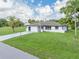 Newly renovated single story home with spacious lawn and driveway at 93 Shade St, Port Charlotte, FL 33953