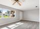 Bright living room with hardwood floors and large windows at 93 Shade St, Port Charlotte, FL 33953