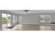 Open living area with light gray walls and wood flooring at 17314 Cape Horn Blvd, Punta Gorda, FL 33955