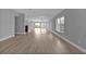 Spacious living room with light wood flooring and large windows at 17314 Cape Horn Blvd, Punta Gorda, FL 33955