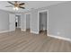Main bedroom with ceiling fan and access to bathroom and closet at 17314 Cape Horn Blvd, Punta Gorda, FL 33955