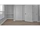 Bedroom with double door closets and wood flooring at 17314 Cape Horn Blvd, Punta Gorda, FL 33955
