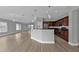 Open kitchen with dark wood cabinets, granite countertops, and stainless steel appliances at 17314 Cape Horn Blvd, Punta Gorda, FL 33955