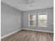 Simple bedroom with light gray walls and ceiling fan at 17314 Cape Horn Blvd, Punta Gorda, FL 33955