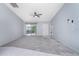 Spacious living room with tiled floors and sliding doors at 3300 Loveland Boulevard # 1904, Port Charlotte, FL 33980