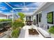 Screened patio furnished for relaxing and dining at 3300 Loveland Boulevard # 1904, Port Charlotte, FL 33980