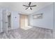 Light and airy bedroom with ceiling fan and access to another room at 3300 Loveland Boulevard # 1904, Port Charlotte, FL 33980