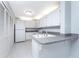 Kitchen with white cabinets, granite countertops, and stainless steel appliances at 3300 Loveland Boulevard # 1904, Port Charlotte, FL 33980