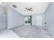 Living room with access to patio, carpet and ceiling fan at 3300 Loveland Boulevard # 1904, Port Charlotte, FL 33980