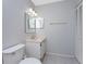 Simple bathroom with vanity, toilet and tiled floor at 3300 Loveland Boulevard # 1904, Port Charlotte, FL 33980