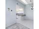Dining room with view into kitchen and tile floor at 3300 Loveland Boulevard # 1904, Port Charlotte, FL 33980