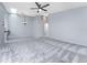 Spacious living room with carpet and ceiling fan at 3300 Loveland Boulevard # 1904, Port Charlotte, FL 33980