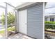 Exterior storage shed with white door at 3300 Loveland Boulevard # 1904, Port Charlotte, FL 33980