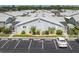 Aerial view of a community of villas with ample parking at 3300 Loveland Boulevard # 1904, Port Charlotte, FL 33980