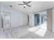 Spacious bedroom with a ceiling fan, sliding doors to patio, and plush carpeting at 3300 Loveland Boulevard # 1904, Port Charlotte, FL 33980