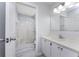 Clean bathroom with white vanity, large mirror, and shower at 3300 Loveland Boulevard # 1904, Port Charlotte, FL 33980