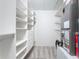 Large walk-in closet with built-in shelves and drawers at 3300 Loveland Boulevard # 1904, Port Charlotte, FL 33980