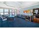 Community room with seating, tables, and informational bulletin boards at 3300 Loveland Boulevard # 1904, Port Charlotte, FL 33980