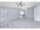 Bright living room with carpet, high ceilings and ceiling fan at 3300 Loveland Boulevard # 1904, Port Charlotte, FL 33980
