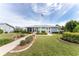 Community center building with landscaping and American flag at 3300 Loveland Boulevard # 1904, Port Charlotte, FL 33980
