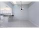 Bright dining room with tile floors and a chandelier at 3300 Loveland Boulevard # 1904, Port Charlotte, FL 33980