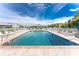 Inviting community pool with ample lounge chairs at 3300 Loveland Boulevard # 1904, Port Charlotte, FL 33980
