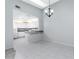 Simple dining room with kitchen views at 3300 Loveland Boulevard # 1904, Port Charlotte, FL 33980