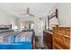 Main bedroom with a king-size bed, dresser, and sliding door to a balcony at 22375 Edgewater Dr # 126, Port Charlotte, FL 33980