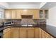 Kitchen sink and countertop with light wood cabinets at 22375 Edgewater Dr # 126, Port Charlotte, FL 33980