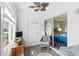 Relaxing sunroom with tiled floor, seating area, and access to the bedroom at 22375 Edgewater Dr # 126, Port Charlotte, FL 33980