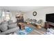 Living room with hardwood floors, comfortable seating, and views to dining area at 22375 Edgewater Dr # 126, Port Charlotte, FL 33980