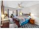 Main bedroom with a king-size bed, dresser, and sliding door to a patio at 22375 Edgewater Dr # 126, Port Charlotte, FL 33980
