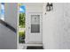 Condo entryway with white door and surrounding building exterior at 22375 Edgewater Dr # 126, Port Charlotte, FL 33980