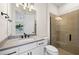 Modern bathroom with walk-in shower and gray vanity at 42548 Little Ridge Rd, Punta Gorda, FL 33982