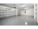 Large two-car garage with epoxy flooring and ample storage at 42548 Little Ridge Rd, Punta Gorda, FL 33982
