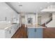 Spacious kitchen featuring white cabinets, an island, and stainless steel appliances at 42548 Little Ridge Rd, Punta Gorda, FL 33982