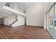 Open living room with high ceilings, hardwood floors and access to a patio at 42548 Little Ridge Rd, Punta Gorda, FL 33982