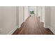Long hallway with wood-look flooring leading to other rooms at 42548 Little Ridge Rd, Punta Gorda, FL 33982