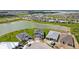 Aerial view of a lakefront community with new construction homes at 42548 Little Ridge Rd, Punta Gorda, FL 33982