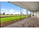 Relaxing screened patio with paver stones and views of the backyard at 42548 Little Ridge Rd, Punta Gorda, FL 33982
