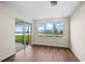 Bright bedroom with hardwood floors and sliding glass doors leading to the patio at 42548 Little Ridge Rd, Punta Gorda, FL 33982