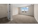 Bright bedroom with neutral walls, carpet, and a large closet at 42548 Little Ridge Rd, Punta Gorda, FL 33982