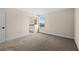 Spacious bedroom with neutral carpeting and large window offering natural light at 42548 Little Ridge Rd, Punta Gorda, FL 33982