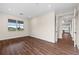 Bright living room with hardwood floors and view into kitchen area at 42548 Little Ridge Rd, Punta Gorda, FL 33982