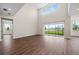 Spacious living room with high ceilings and sliding glass doors at 42548 Little Ridge Rd, Punta Gorda, FL 33982