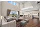 Open concept living space with high ceilings, modern kitchen, and hardwood floors at 42548 Little Ridge Rd, Punta Gorda, FL 33982
