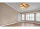 Living room with tile floors, ceiling fan, and large windows at 5149 Latham Ter, Port Charlotte, FL 33981