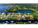 Aerial view showcasing a canal-front house with a pool and private dock at 5149 Latham Ter, Port Charlotte, FL 33981
