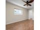 Bedroom with tile floors, ceiling fan and window at 5149 Latham Ter, Port Charlotte, FL 33981