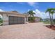 One-story home with a large garage and paver driveway at 5149 Latham Ter, Port Charlotte, FL 33981